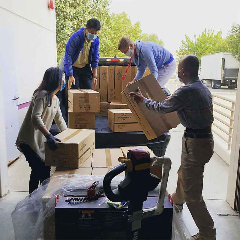 Logistics team carefully handling parcels